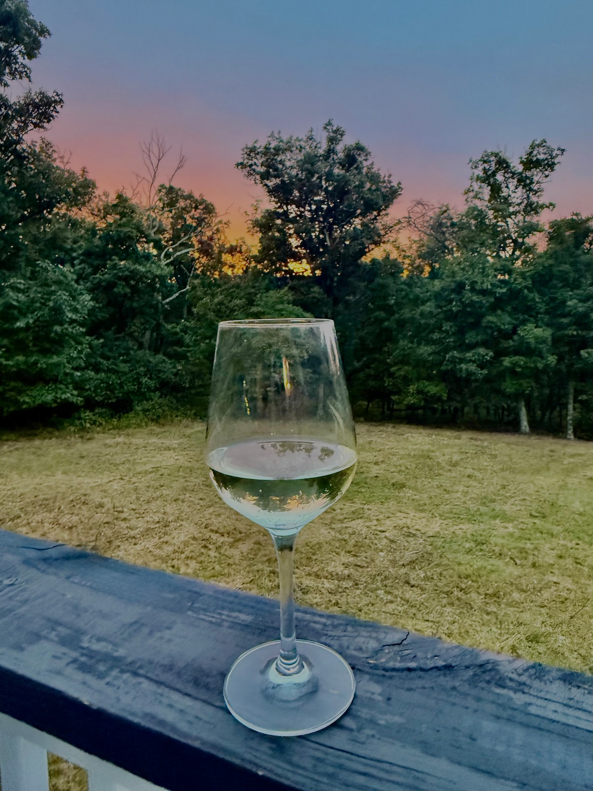 Dusk with a glass of wine